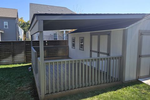 Covered porch built onto a 10x20 custom shed